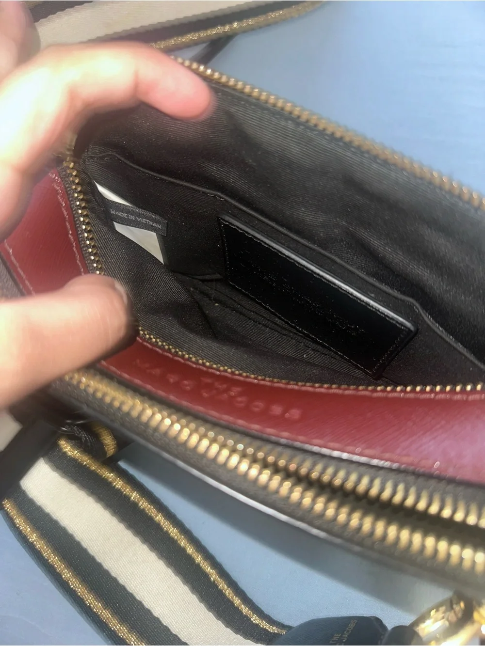Marc Jacob’s Black and Red Crossbody Camera Bag with Gold Hardware